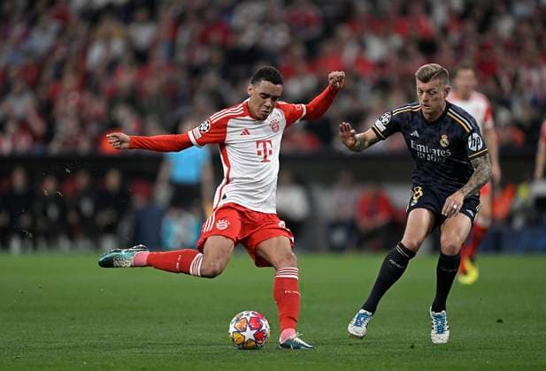 30 04 2024, Football UEFA Championsleague 2023 2024 Semifinal, FC Bayern Munich Real Madrid, at Allianz Arena Munich L R Jamal Musiala Bayern Munich vs Toni Kroos Real Madrid DFL and DFB regulations prohibit any use of photographs as image sequences and or quasi video