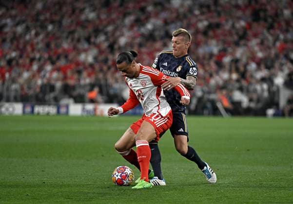30 04 2024, Football UEFA Championsleague 2023 2024 Semifinal, FC Bayern Munich Real Madrid, at Allianz Arena Munich L R Leroy Sane Bayern Munich vs Toni Kroos Real Madrid DFL and DFB regulations prohibit any use of photographs as image sequences and or quasi video