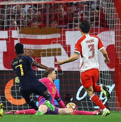 Vinicius Junior of Real Madrid scores the opening goal past Manuel Neuer of Bayern Munich Bayern Munich v Real Madrid, UEFA Champions League, Semi Final, First Leg, Football, Allianz Arena, Munich, Germany - 30 Apr 2024 EDITORIAL USE ONLY No use with unauthorised audio, video, data, fixture lists, club league logos or live services. Online in-match use limited to 120 images, no video emulation. No use in betting, games or single club league player publications. Copyright: xMichaelxZemanek Shutterstockx 14454338r