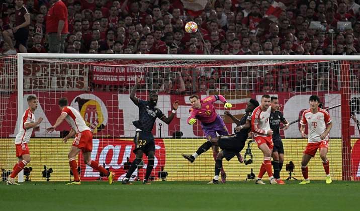 30 04 2024, Football UEFA Championsleague 2023 2024 Semifinal, FC Bayern Munich Real Madrid, at Allianz Arena Munich L R Goalkeeper Manuel Neuer Bayern Munich clears in front of Aurelien Tchouameni Real Madrid DFL and DFB regulations prohibit any use of photographs as image sequences and or quasi video