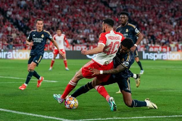 Munich, Germany, April 30th 2024: Rodrygo (11 Real Madrid) and Noussair Mazraoui (40 Bayern Munich) battle for the ball (duel) during the UEFA Champions League semifinal football match between FC Bayern Munich and Real Madrid at Allianz Arena in Munich, Germany. (Daniela Porcelli SPP) Copyright: xDanielaxPorcellix xSPPx spp-en-DaPoSp-20240430-DSC03643