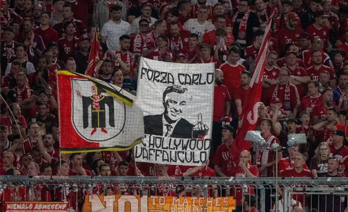 Football, Men, 2023 2024 season, Champions League semi-final, first leg, FC Bayern Munich Real Madrid, Bayern fans with double holder Forza Carlo, FC Hollywood Vaffanculo, 30 04 2024, Copyright: xMatthiasxKochx