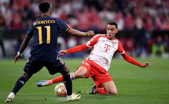 FOOTBALL CHAMPIONS LEAGUE SEASON 2023 2024 semi-final, first leg FC Bayern Muenchen Real Madrid 30 04 2024 Rodrygo left, Real Madrid vs Jamal Musiala right, FC Bayern Muenchen