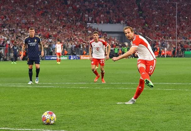 Harry Kane of Bayern Munich scores his sides second goal from penalty kick Bayern Munich v Real Madrid, UEFA Champions League, Semi Final, First Leg, Football, Allianz Arena, Munich, Germany - 30 Apr 2024 EDITORIAL USE ONLY No use with unauthorised audio, video, data, fixture lists, club league logos or live services. Online in-match use limited to 120 images, no video emulation. No use in betting, games or single club league player publications.  Copyright: xMichaelxZemanek Shutterstockx 14454338am