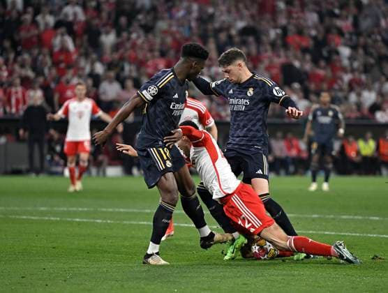 30 04 2024, Football UEFA Championsleague 2023 2024 Semifinal, FC Bayern Munich Real Madrid, at Allianz Arena Munich Jamal Musiala mi , Bayern Munich is fouled by Lucas Vazquez re , Real Madrid DFL and DFB regulations prohibit any use of photographs as image sequences and or quasi video