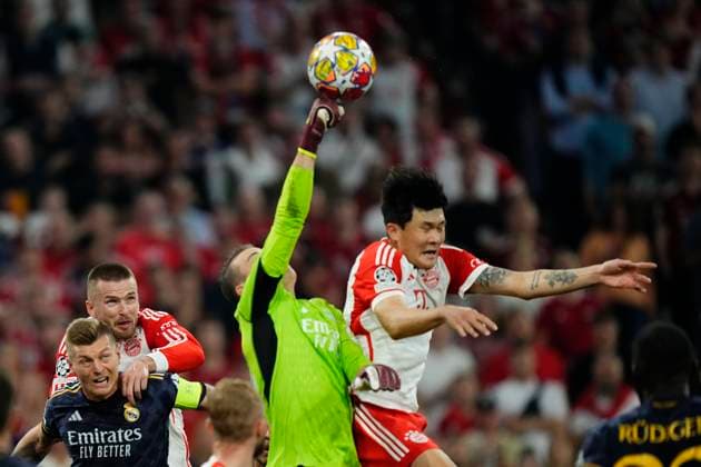 FC Bayern München v Real Madrid: Semi-final First Leg - UEFA Champions League 2023 24 Andriy Lunin goalkeeper of Real Madrid and Ukraine makes a save during the UEFA Champions League semi-final first leg match between FC Bayern München and Real Madrid at Allianz Arena on April 30, 2024 in Munich, Germany. Munich Germany  Copyright: xJosexBretonx originalFilename:breton-fcbayern240430_npOZs.jpg