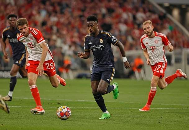 (240501) -- MUNICH, May 1, 2024 -- Vinicius Junior (2nd R) of Real Madrid breaks through during the UEFA Champions League semifinal 1st Leg football match between Bayern Munich and Real Madrid in Munich, Germany, April 30, 2024. (Photo by Xinhua) (SP)GERMANY-MUNICH-FOOTBALL-UEFA CHAMPIONS LEAGUE-BAYERN MUNICH VS REAL MADRID PhilippexRuiz 