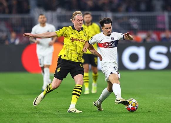 Vitinha of Paris Saint-Germain and Julian Brandt of Borussia Dortmund Borussia Dortmund v Paris Saint-Germain, UEFA Champions League, Semi Final, First Leg, Football, Signal Iduna Park, Dortmund, Germany - 01 May 2024 EDITORIAL USE ONLY No use with unauthorised audio, video, data, fixture lists, club league logos or live services. Online in-match use limited to 120 images, no video emulation. No use in betting, games or single club league player publications.  Copyright: xMichaelxZemanek Shutterstockx 14454339ah