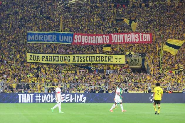 Borussia Dortmund fans on the Suedtribuene protest with banners against the publication of mugshots of fans, UEFA Champions League 2023 24 Semi finals First Leg, Borussia Dortmund vs Paris Saint Germain, Signal Iduna Park, 01 05 2024, Dortmund, Germany