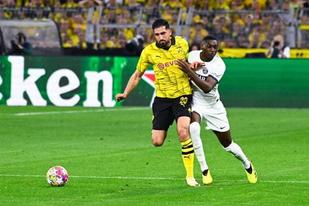 Emre Can ( 23 - Borussia Dortmund ) and Randal Kolo Muani ( 23 - PSG ) during the UEFA Champions League match between Borussia Dortmund and Paris Saint Germain at BVB Stadion Dortmund on May 01, 2024 in Dortmund, Germany. ( Photo by federico pestellini panoramic ) - FOOTBALL : Borussia Dortmund vs Paris Saint Germain - Ligue des Champions - 01 05 2024 FedericoPestellini Panoramic 