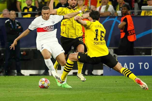(240502) -- DORTMUND, May 2, 2024 -- Mats Hummels (R) of Borussia Dortmund vies with Kylian Mbappe of Paris Saint-Germain during the UEFA Champions League semi-final first leg football match between Borussia Dortmund and Paris Saint-Germain in Dortmund, Germany, May 1, 2024. (Photo by Xinhua) (SP)GERMANY-DORTMUND-FOOTBALL-UEFA CHAMPIONS LEAGUE-DORTMUND VS PSG JoachimxBywaletz 