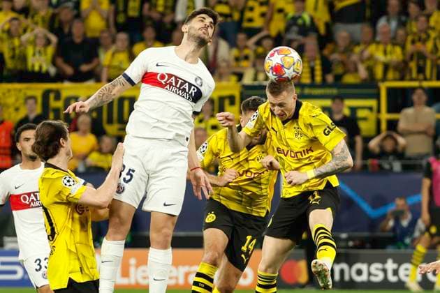 (240502) -- DORTMUND, May 2, 2024 -- Marco Reus (1st R) of Borussia Dortmund and Lucas Beraldo (C) of Paris Saint-Germain head for a ball during the UEFA Champions League semi-final first leg football match between Borussia Dortmund and Paris Saint-Germain in Dortmund, Germany, May 1, 2024. (Photo by Xinhua) (SP)GERMANY-DORTMUND-FOOTBALL-UEFA CHAMPIONS LEAGUE-DORTMUND VS PSG JoachimxBywaletz 