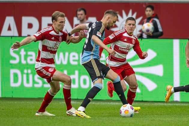 Soccer 2 Bundesliga, Season 2023 2024, Matchday 32, Fortuna Duesseldorf 1 FC Nuernberg on 03 05 2024 in the Merkur Spiel Arena in Duesseldorf duel between Vincent Vermeij Fortuna Duesseldorf, 09 , Cristos Tzolis Fortuna Duesseldorf, 07 and Florian Huebner 1 FC Nuernberg, 19 Important note In accordance with the regulations of the DFL German Football League and the DFB German Football Association, it is prohibited to utilize or have utilized photographs taken in the stadium and or of the match in the form of sequential images and or video-like photo series Foto Kirchner Media TH Copyright: xKirchner-Media THx