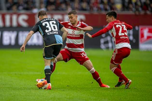 Soccer 2 Bundesliga, Season 2023 2024, Matchday 32, Fortuna Duesseldorf 1 FC Nuernberg on 03 05 2024 in the Merkur Spiel Arena in Duesseldorf duel between Lukas Schleimer 1 FC Nuernberg, 36 , Tim Oberdorf Fortuna Duesseldorf, 15 and Shinta Appelkamp Fortuna Duesseldorf, 23 Important note According to the regulations of the DFL German Football League and the DFB German Football Association, it is prohibited to utilize or have utilized photographs taken in the stadium and or of the match in the form of sequential images and or video-like photo series Foto Kirchner Media TH Copyright: xKirchner-Media THx