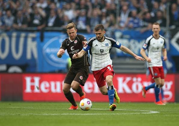 03 05 2024, Soccer 2 Bundesliga 2023 2024, Matchday 32, Hamburger SV FC St Pauli , at Volksparkstadion Hamburg L R Johannes Eggestein FC St Pauli vs Lukasz Poreba Hamburg DFL and DFB regulations prohibit any use of photographs as image sequences and or quasi video