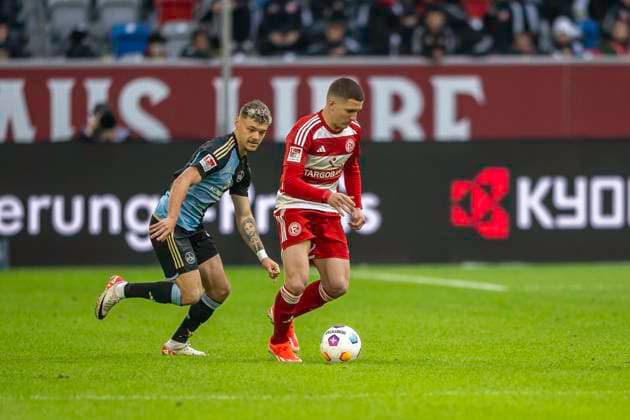 Soccer 2 Bundesliga, Season 2023 2024, Matchday 32, Fortuna Duesseldorf 1 FC Nuernberg on 03 05 2024 in the Merkur Spiel Arena in Duesseldorf duel between Jannik Hofmann 1 FC Nuernberg, 43 and Cristos Tzolis Fortuna Duesseldorf, 07 Important note In accordance with the regulations of the DFL German Football League and the DFB German Football Association, it is prohibited to use or have used photographs taken in the stadium and or of the match in the form of sequential images and or video-like photo series Foto Kirchner Media TH Copyright: xKirchner-Media THx
