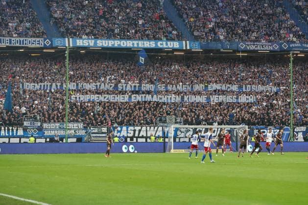 03 05 2024, xtgx, Fussball 2 Bundesliga, Hamburger SV FC St Pauli emspor, v l Fans from HSV hold up a banner, poster Identity and consistency instead of big names and simple solutions Disempower string-pullers, Kuhne Verpiss Dich DFL DFB REGULATIONS PROHIBIT ANY USE OF PHOTOGRAPHS as IMAGE SEQUENCES and or QUASI VIDEO Hamburg