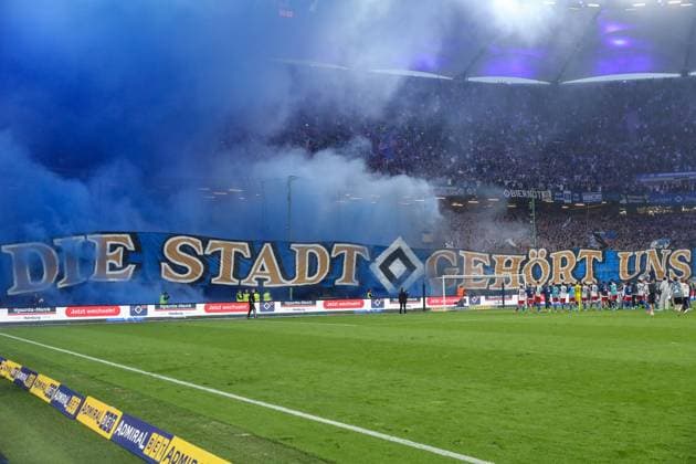 2 Bundesliga Hamburger SV FC St Pauli on 03 05 2024 at Volksparkstadion in Hamburg HSV fans celebrate the derby win with pyrotechnics and a banner banner saying Die Stadt gehört uns MH