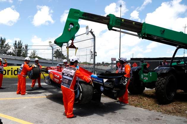 MIAMI GARDENS, FL - MAY 03: A crane picks up the race car of Scuderia Ferrari driver Charles Leclerc 16 of Monaco in turn 15 during practice for the F1 Crypto.com Miami Grand Prix on May 3, 2024 at Miami International Autodrome in Miami Gardens, FL. (Photo by Jeff Robinson Icon Sportswire) AUTO: MAY 03 F1 Crypto.com Miami Grand Prix EDITORIAL USE ONLY Icon24050337731