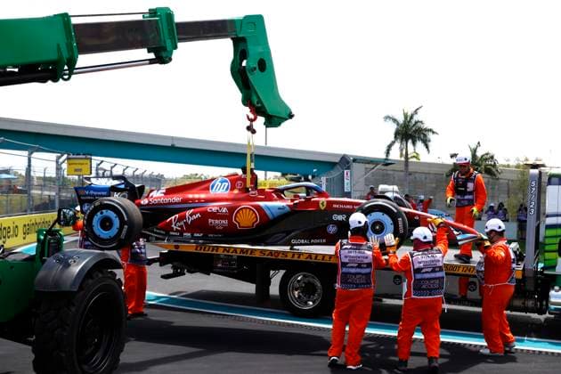 MIAMI GARDENS, FL - MAY 03: A crane picks up the race car of Scuderia Ferrari driver Charles Leclerc 16 of Monaco in turn 15 during practice for the F1 Crypto.com Miami Grand Prix on May 3, 2024 at Miami International Autodrome in Miami Gardens, FL. (Photo by Jeff Robinson Icon Sportswire) AUTO: MAY 03 F1 Crypto.com Miami Grand Prix EDITORIAL USE ONLY Icon24050338181