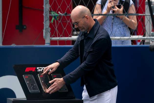 Retired French professional footballer Zinedine Zidane places the first place sprint plaque at an award presentation following the spring race during the Formula One Miami Grand Prix at the Miami International Autodrome in Miami Gardens, Florida on Saturday, May 4, 2024  MIA20240504441 GREGxNASH