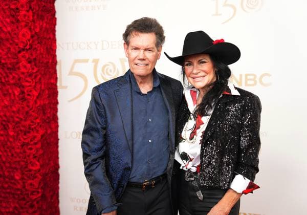 LOUISVILLE, KY - MAY 04: Country singer Randy Travis and his wife Mary Davis walk the red carpet before the 150th running of the Kentucky Derby on May 4, 2024, at Churchill Downs in Louisville, Ky. (Photo by Jeff Moreland Icon Sportswire) HORSE RACING: MAY 04 Kentucky Derby EDITORIAL USE ONLY Icon168240504030