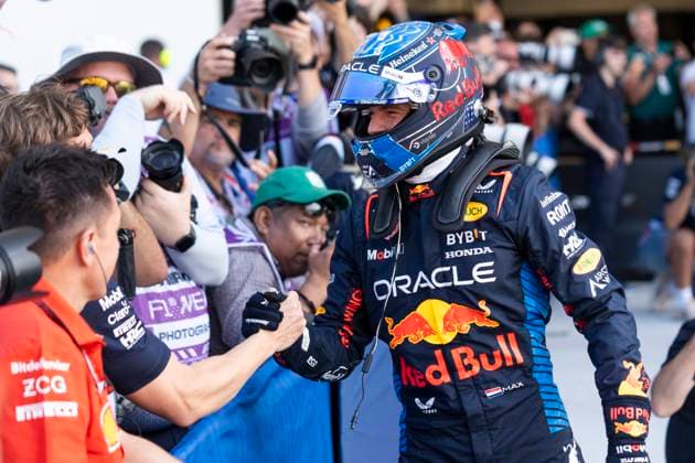 Dutch Formula One driver Max Verstappen of Red Bull Racing greets a team member in parc fermé after securing pole position for the Formula One Miami Grand Prix at the Miami International Autodrome in Miami Gardens, Florida on Saturday, May 4, 2024  MIA20240504473 GREGxNASH