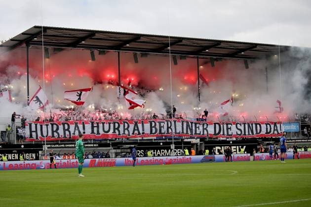 05 05 2024, xmohx, Football 2 Bundesliga, SV Elversberg Hertha BSC Berlin emspor, v l fans, atmosphere, scarves, flags, visitors, jerseys, Ultras, Hertha BSC Berlin, Harlekins to end pyrotechnics, Bengalos, smoke DFL DFB REGULATIONS PROHIBIT ANY USE OF PHOTOGRAPHS as IMAGE SEQUENCES and or QUASI VIDEO Elversberg