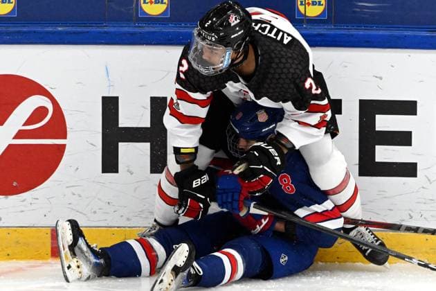 Kashawn Aitcheson (top) of Canada pins Teddy Stiga of USA to ice during the 2024 IIHF Ice hockey, Eishockey U18 world championships final match between the United States and Canada in Espoo, Finland, on May 5, 2024. Espoo Finland LKFTJ20240505181742CVGJ  Copyright: xJussixNukarix LKFTJ20240505181742CVGJ