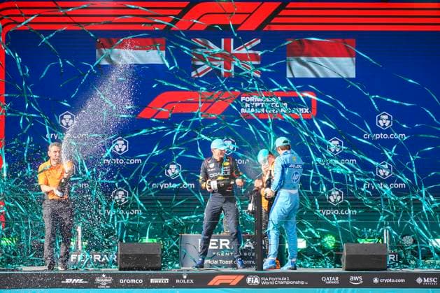 5th May 2024; Miami International Autodrome, Miami, Florida, USA; Formula 1 Crypto.com Miami Grand Prix 2024; Race Day; McLaren driver Lando Norris of the United Kingdom, Oracle Red Bull Racing driver Max Verstappen of the Netherlands, Scuderia Ferrari driver Charles Leclerc of Monaco and McLaren team principal Andrea Stella spray each other with champagne as they celebrate on the podium.  ActionPlus12639307 DouglasxMurray