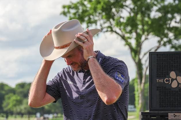MCKINNEY, TX - MAY 05: Taylor Pendrith (CAN) puts on his new Stetson hat after winning the PGA, Golf Herren CJ CUP Byron Nelson on May 5, 2024, at TPC Craig Ranch in McKinney, TX. (Photo by David Buono Icon Sportswire) GOLF: MAY 05 PGA CJ CUP Byron Nelson EDITORIAL USE ONLY Icon240505002