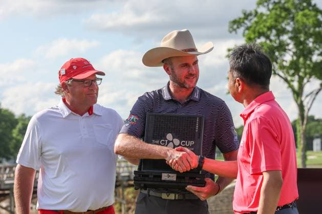 MCKINNEY, TX - MAY 05: Taylor Pendrith (CAN) shakes hands with Wookho Kyeong while he holds the CJ CUP trophy after winning the PGA, Golf Herren CJ CUP Byron Nelson on May 5, 2024, at TPC Craig Ranch in McKinney, TX. (Photo by David Buono Icon Sportswire) GOLF: MAY 05 PGA CJ CUP Byron Nelson EDITORIAL USE ONLY Icon240505007