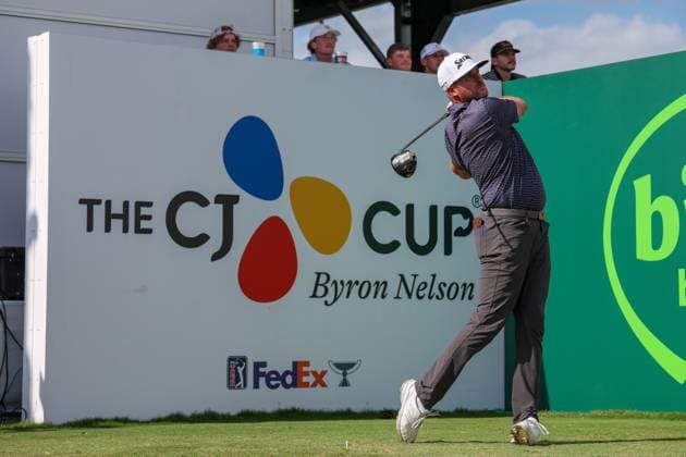 MCKINNEY, TX - MAY 05: Taylor Pendrith (CAN) tees off on the 18th hole with the CJ CUP logo behind him during the final round of the PGA, Golf Herren CJ CUP Byron Nelson on May 5, 2024, at TPC Craig Ranch in McKinney, TX. (Photo by David Buono Icon Sportswire) GOLF: MAY 05 PGA CJ CUP Byron Nelson EDITORIAL USE ONLY Icon240505047