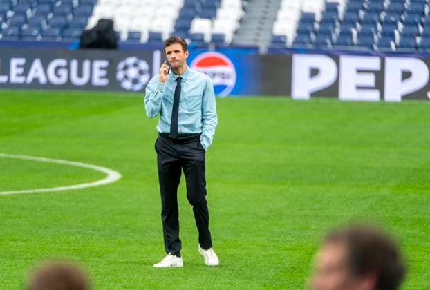07 05 2024, Football UEFA Champions League 2023 2024 1 day before the semi-final, Real Madrid FC Bayern Munich, Arrival of FC Bayern team at the Santiago Bernabeu stadium Madrid Thomas Müller FC Bayern Munich on the phone on the pitch