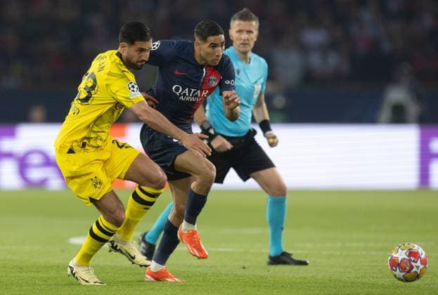 Emre Can of Borussia Dortmund battles with Achraf Hakimi of Paris Saint-Germain Paris Saint-Germain v Borussia Dortmund, UEFA Champions League, Semi Final, Second Leg, Football, Parc des Princes, Paris, France - 07 May 2024 EDITORIAL USE ONLY No use with unauthorised audio, video, data, fixture lists, club league logos or live services. Online in-match use limited to 120 images, no video emulation. No use in betting, games or single club league player publications. Copyright: xPaulxCurrie Shutterstockx 14458453t