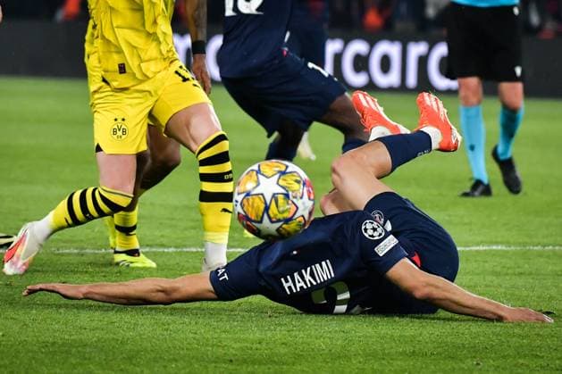 Champions League PSG vs Borussia Dortmund FA Paris Saint-Germain?s defender Achraf Hakimi is tackled during the UEFA Champions League semi-final football match between Paris Saint-Germain and Borussia Dortmund at the Parc des Princes stadium in Paris on May 7, 2024. Photo by Firas Abdullah ABACAPRESS.COM  Copyright: xAbdullahxFiras ABACAx