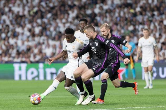 UEFA CHAMPIONS LEAGUE - Real Madrid vs FC Bayern München MADRID, SPAIN - MAY 8: Vinicius jr of Real Madrid and Eric Dier of Bayern Munich fight for the ball during the UEFA CHAMPIONS LEAGUE 2023 24 semi-finals second leg match between Real Madrid and FC Bayern München at Santiago Bernabeu Stadium. (Photo by Guillermo Martinez) Madrid Santiago BernabÃ u Stadium Spain Copyright: xGuillermoxMartinezx