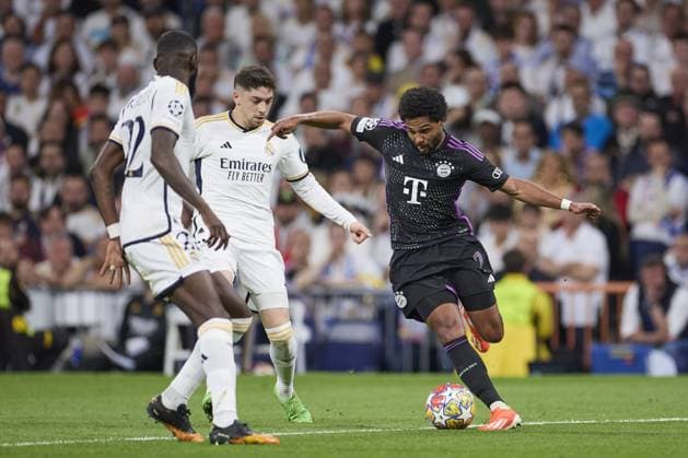Serge Gnabry of FC Bayern Munich compete for the ball with Fede Valverde of Real Madrid CF during the UEFA Champions League match between Real Madrid and Bayern Munich at Santiago Bernabeu Stadium on May 8, 2024 in Madrid, Spain. (Photo by: LGM) FOOTBALL : Real Madrid vs Bayern Munich- UEFA Champions League - 08 05 2024 LGM Panoramic 