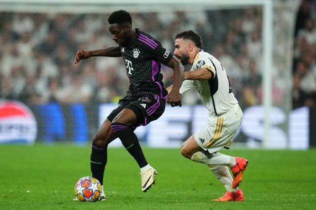 ESP: Real Madrid v FC Bayern Munchen. UEFA Champions League match. Semi-finals Alphonso Davies of Bayern Munchen and Daniel Carvajal of Real Madrid during the UEFA Champions League match, Semi-finals, 2nd leg, between Real Madrid and FC Bayern Munchen played at Santiago Bernabeu Stadium on May 8, 2024 in Madrid Spain. kpng Copyright: xSergioxRuizx xPRESSINPHOTOx PS_240508_018