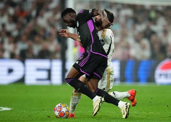 ESP: Real Madrid v FC Bayern Munchen. UEFA Champions League match. Semi-finals Alphonso Davies of Bayern Munchen and Daniel Carvajal of Real Madrid during the UEFA Champions League match, Semi-finals, 2nd leg, between Real Madrid and FC Bayern Munchen played at Santiago Bernabeu Stadium on May 8, 2024 in Madrid Spain. kpng Copyright: xSergioxRuizx xPRESSINPHOTOx PS_240508_019
