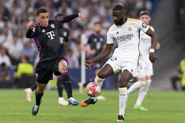 Jamal Musiala of Bayern Munich (L) battles with Antonio Rüdiger of Real Madrid (R) Real Madrid v Bayern Munich, UEFA Champions League, Semi-Final, Football, Santiago Bernabeu Stadium, Madrid, Spain - 08 May 2024  Copyright: xRubenxAlbarran Shutterstockx 14469131at