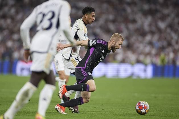 Konrad Laimer of FC Bayern Munich compete for the ball with Jude Bellingham of Real Madrid CF during the UEFA Champions League match between Real Madrid and Bayern Munich at Santiago Bernabeu Stadium on May 8, 2024 in Madrid, Spain. (Photo by: LGM) FOOTBALL : Real Madrid vs Bayern Munich- UEFA Champions League - 08 05 2024 LGM Panoramic 