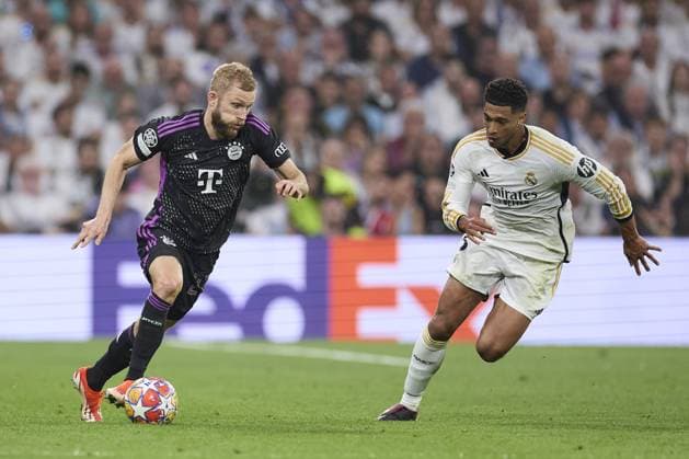 Konrad Laimer of FC Bayern Munich compete for the ball with Jude Bellingham of Real Madrid CF during the UEFA Champions League match between Real Madrid and Bayern Munich at Santiago Bernabeu Stadium on May 8, 2024 in Madrid, Spain. (Photo by: LGM) FOOTBALL : Real Madrid vs Bayern Munich- UEFA Champions League - 08 05 2024 LGM Panoramic 