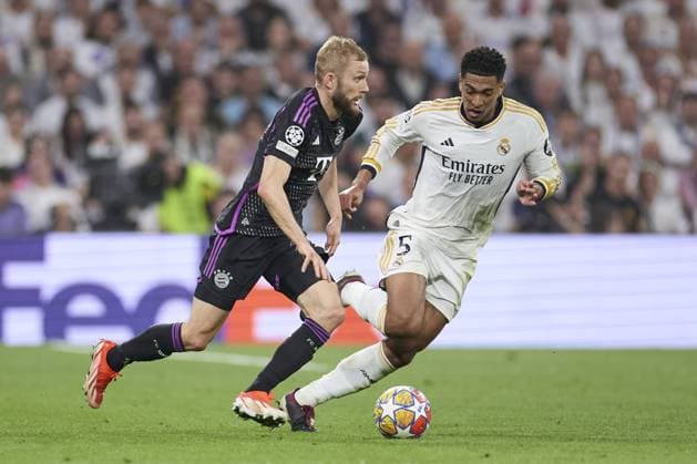 Konrad Laimer of FC Bayern Munich compete for the ball with Jude Bellingham of Real Madrid CF during the UEFA Champions League match between Real Madrid and Bayern Munich at Santiago Bernabeu Stadium on May 8, 2024 in Madrid, Spain. (Photo by: LGM) FOOTBALL : Real Madrid vs Bayern Munich- UEFA Champions League - 08 05 2024 LGM Panoramic 