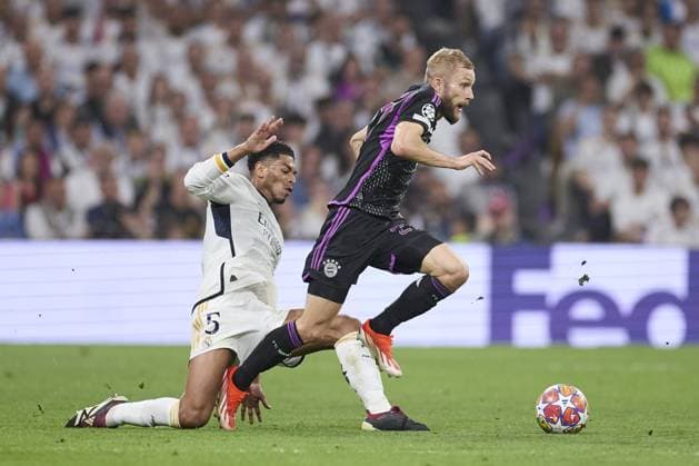 Konrad Laimer of FC Bayern Munich compete for the ball with Jude Bellingham of Real Madrid CF during the UEFA Champions League match between Real Madrid and Bayern Munich at Santiago Bernabeu Stadium on May 8, 2024 in Madrid, Spain. (Photo by: LGM) FOOTBALL : Real Madrid vs Bayern Munich- UEFA Champions League - 08 05 2024 LGM Panoramic 