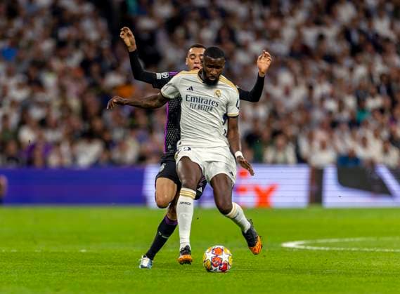 08 05 2024, Football UEFA Champions League 2023 2024 semi-final, Real Madrid FC Bayern Munich, at Estadio Santiago Bernabeu, Madrid, Antonio Rüdiger in front, Real Madrid vs Jamal Musiala FC Bayern Munich
