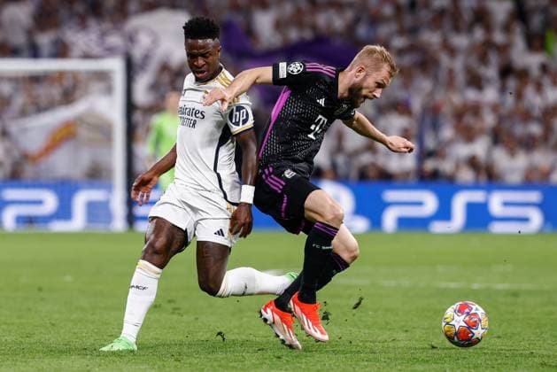 May 8, 2024, Madrid, Madrid, SPAIN: Vinicius Junior of Real Madrid and Konrad Laimer of Bayern Munich in action during the UEFA Champions League, Semi Final Second Leg, football match played between Real Madrid and FC Bayern Munich at Santiago Bernabeu stadium on May 08, 2024 in Madrid, Spain. Madrid SPAIN - ZUMAa181 20240508_zaa_a181_062 Copyright: xIrinaxR.xHipolitox