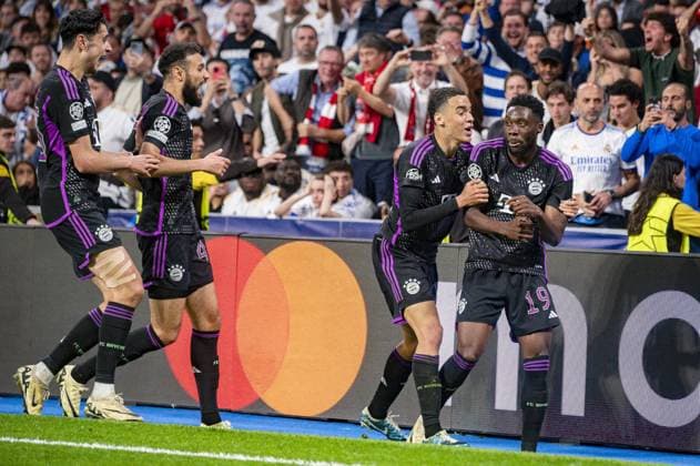 UEFA Champions League football match - Real Madrid vs Bayern Munich MADRID, SPAIN - MAY 8: Alphonso Davies of FC Bayern Munchen (R) seen celebrating his goal with Jamal Musitala of FC Bayern Munchen (L) during the UEFA Champions League semi-final second leg match between Real Madrid and FC Bayern Munchen at Estadio Santiago Bernabeu on May 8, 2024 in Madrid, Spain. Madrid Spain  Copyright: xIPAxSport ABACAx