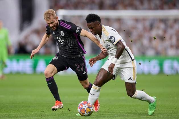 May 8, 2024, Madrid, Spain: Konrad Laimer (L) of FC Bayern Munchen and Vinicius Junior (R) of Real Madrid CF in action during the 2023 2024 UEFA Champions League semi-final second leg football match between Real Madrid CF and FC Bayern Munchen at Santiago Bernabeu stadium. Final score: Real Madrid CF 2:1 FC Bayern Munchen Madrid Spain - ZUMAs197 20240508_aaa_s197_461 Copyright: xFedericoxTitonex