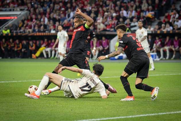 UEFA Europa League semi-final Bayer 04 Leverkusen vs AS Roma, 09 05 2024 Jonathan Tah Bayer 04 Leverkusen, 4 saves in the penalty area from Sardar Azmoun AS Roma, 17 , right Piero Hincapie Bayer 04 Leverkusen, 3 during the Europa League semi-final between Bayer 04 Leverkusen and AS Roma at BayArena on 09 05 2024 in Leverkusen, Germany DFL REGULATIONS PROHIBIT ANY USE OF PHOTOGRAPHS AS IMAGE SEQUENCES AND OR QUASI VIDEO Copyright: xBEAUTIFULxSPORTS AxelxKohringx